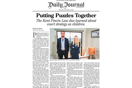 Two people in business attire stand in an office with large windows, featured in a newspaper article titled "Putting Puzzles Together" from the Daily Journal.